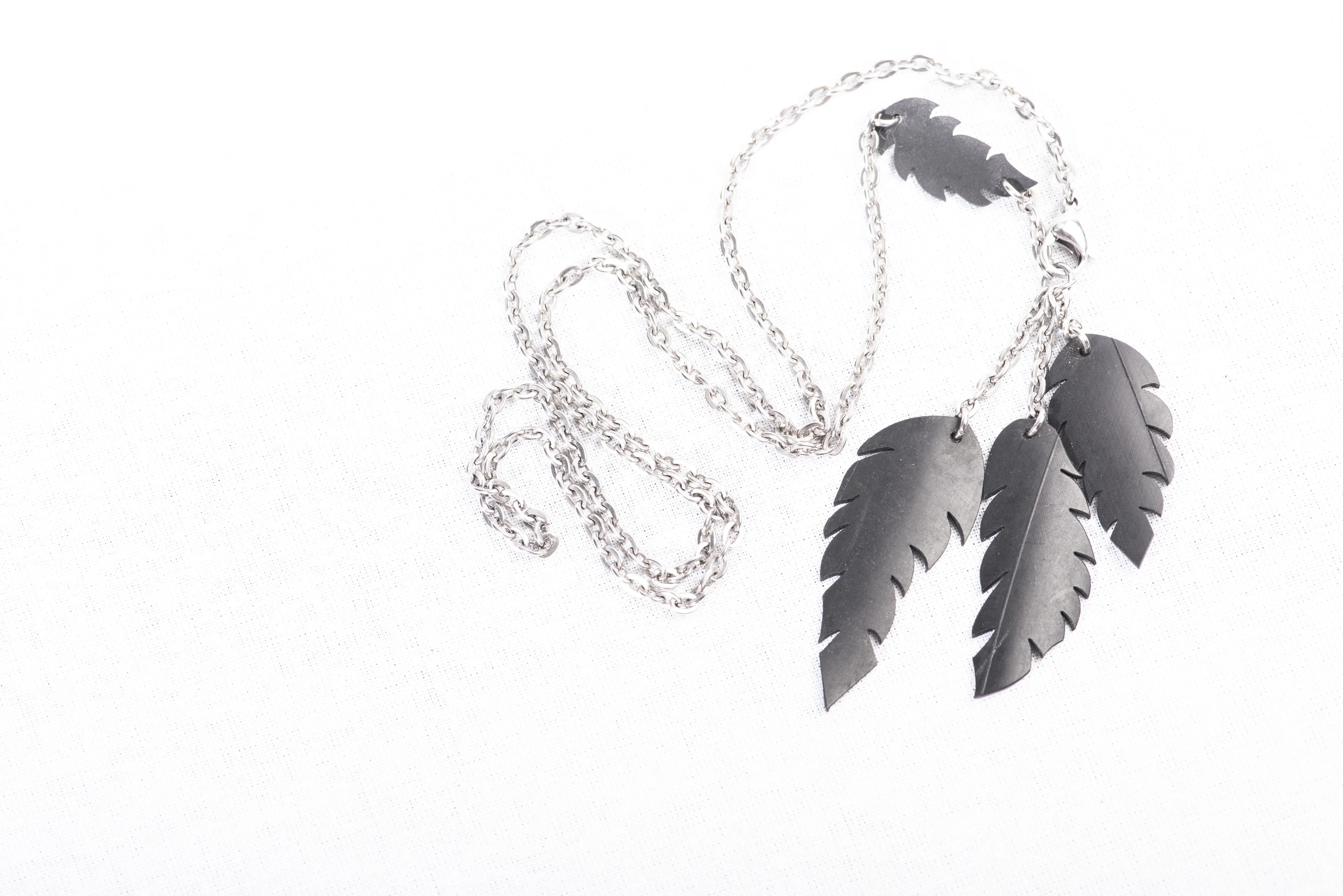 a-symmetrical feather necklace