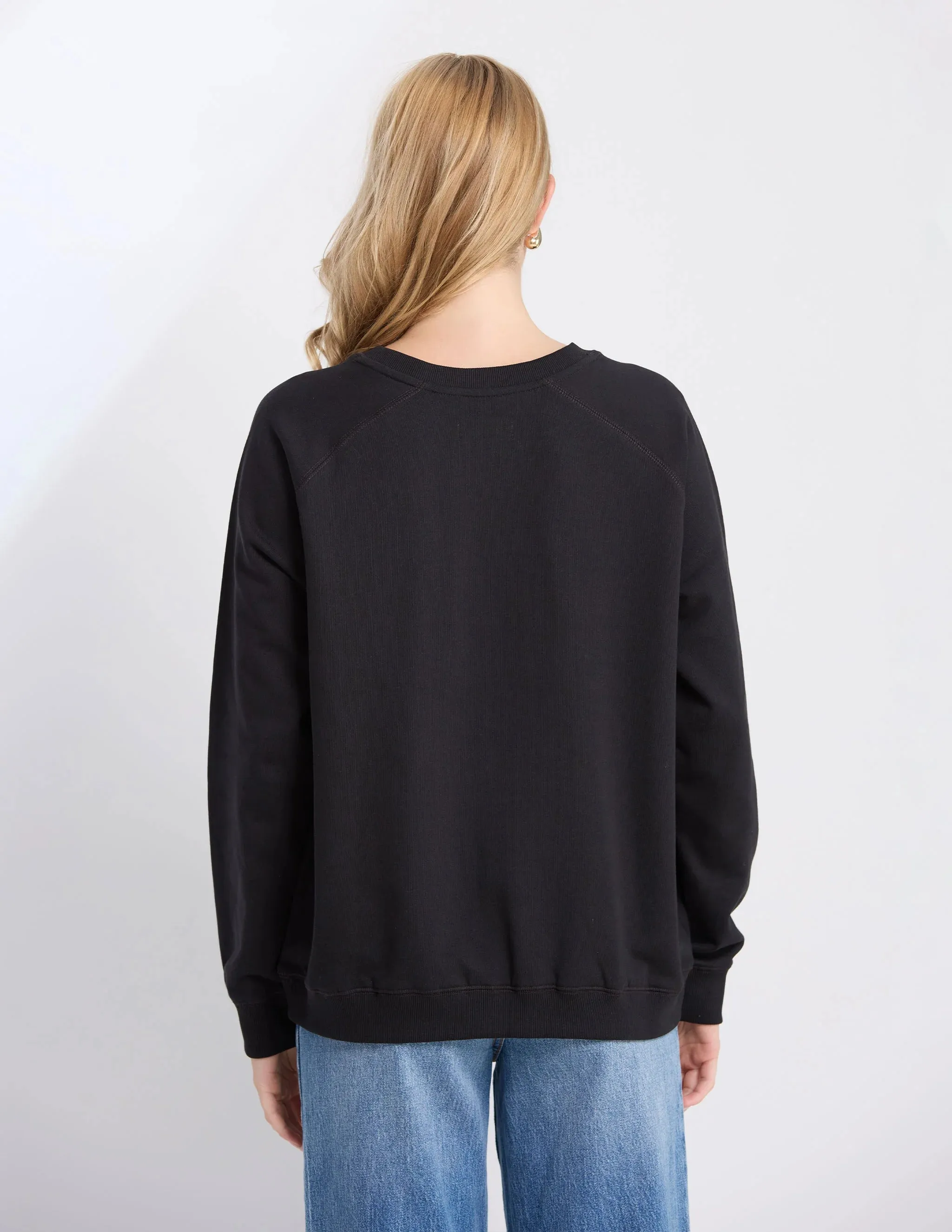 BLACK STAR CROSSED SWEATER