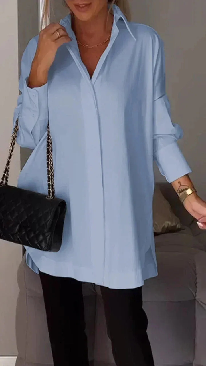 Stylish oversized blouse with rolled-up sleeves