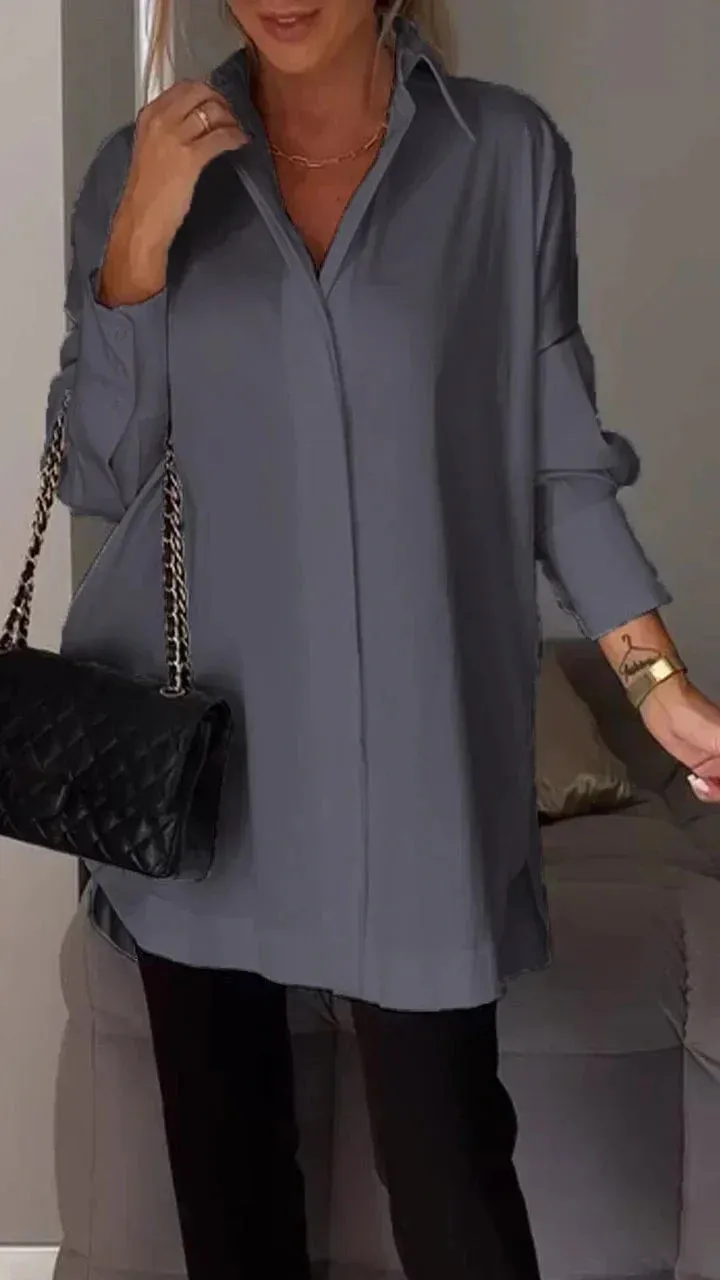 Stylish oversized blouse with rolled-up sleeves